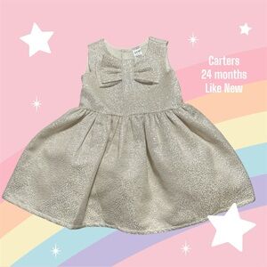 Like New.

Carters champagne shimmery dress. 24 months.